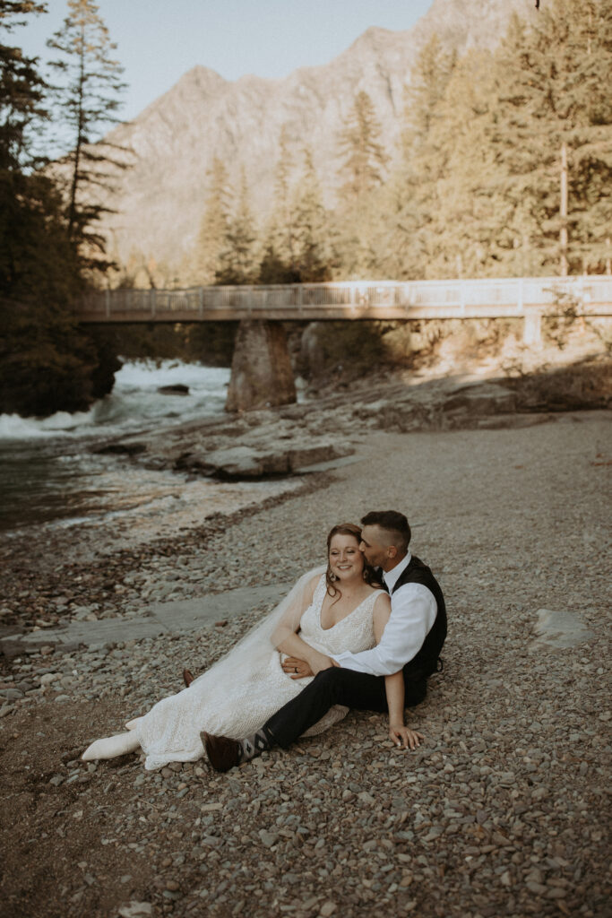 groom kissing the bride on the cheek