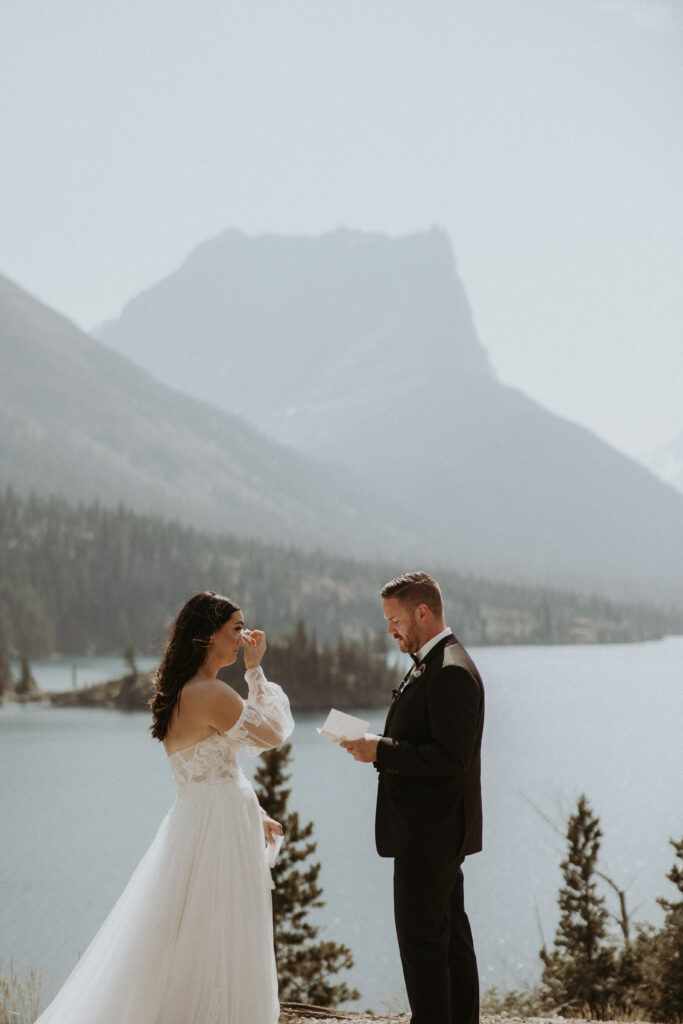 Bride emotional while reading her vows to the groom