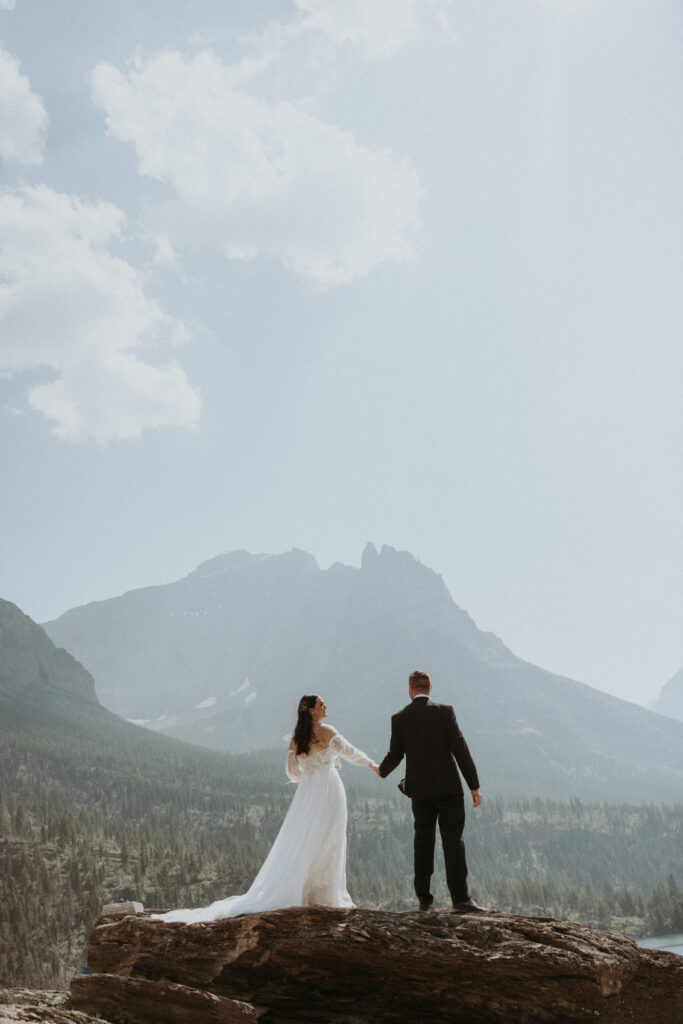 Bride and groom holding hands during their photoshoot