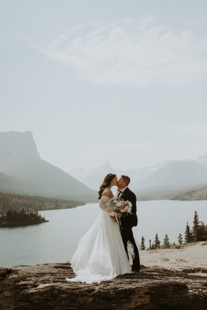 Cute picture of the bride and groom kissing during the bridal portraits