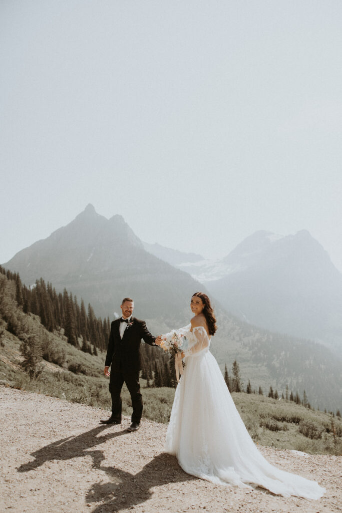 Picture of the bride and groom holding hands