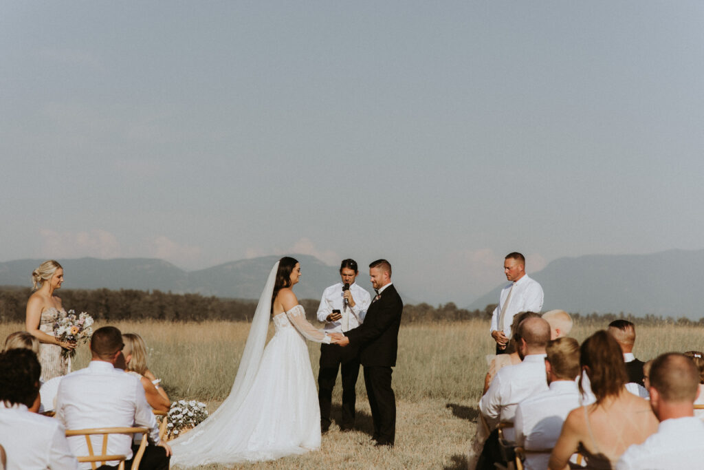 bride and groom holding hands at their ceremony