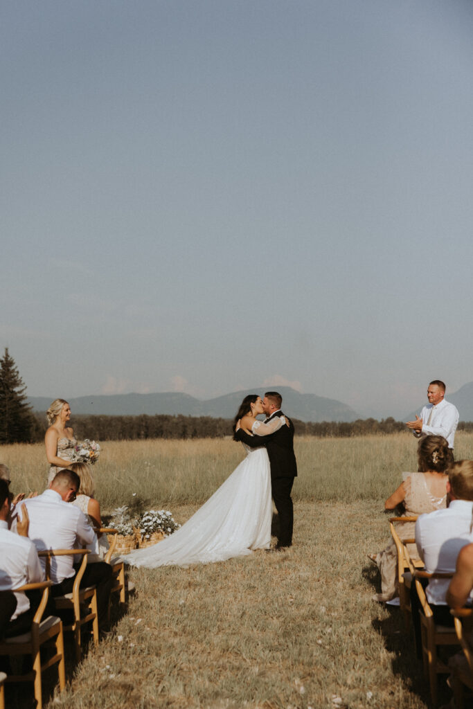 bride and groom kissing after their ceremony