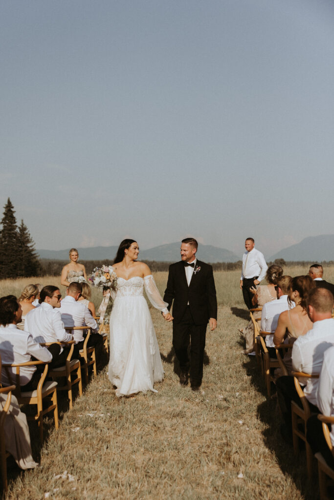bride and groom heading to their reception