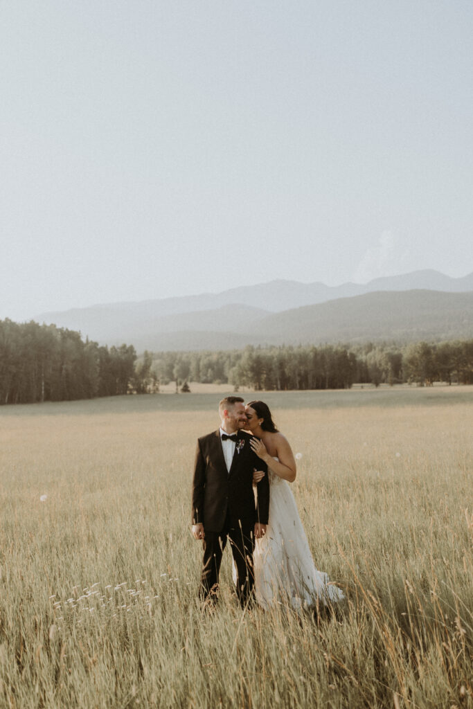 bride kissing the groom on the cheek