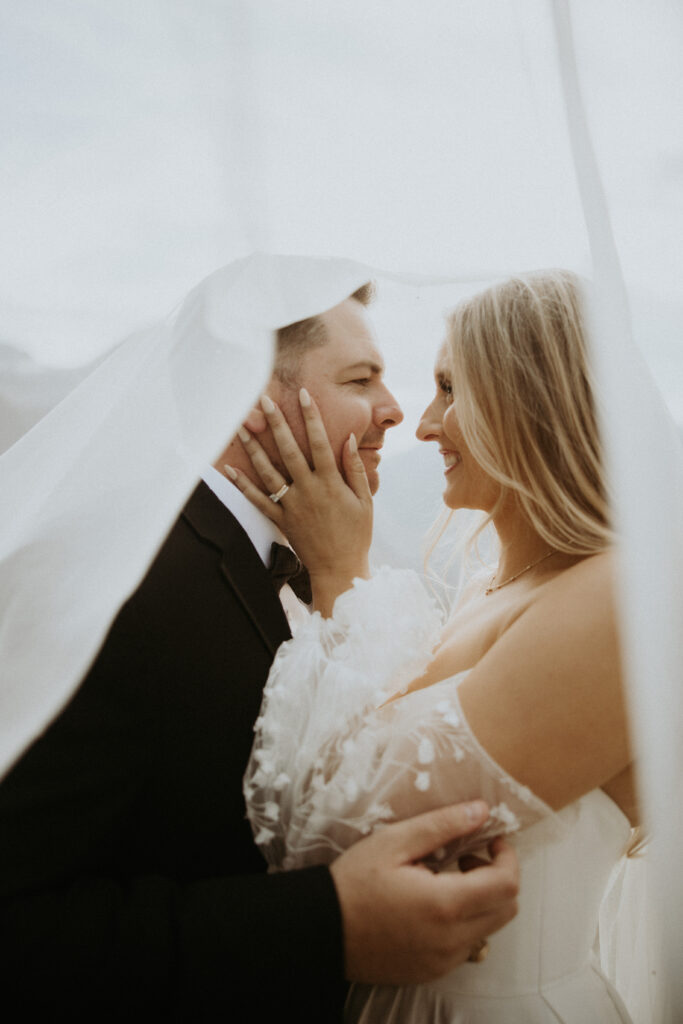 Bride and groom, smiling at each other