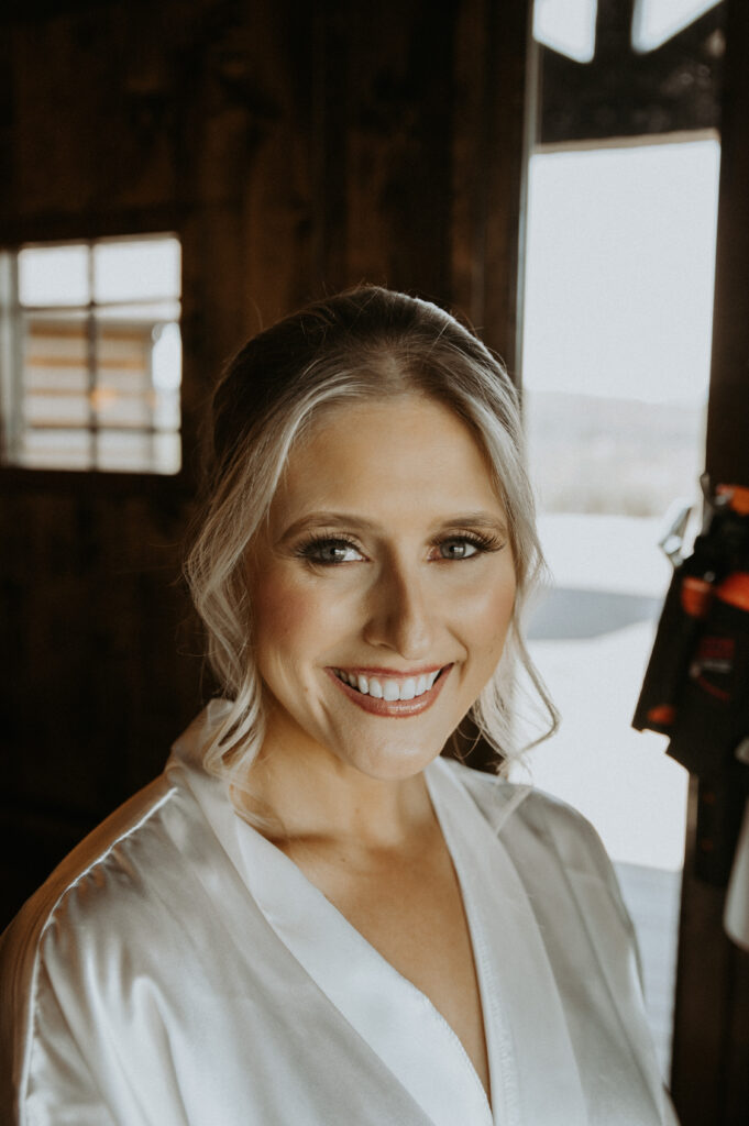 Bride getting her makeup done for her ceremony