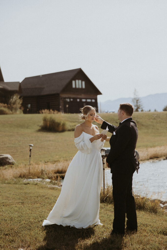 Bride and groom emotional at vows