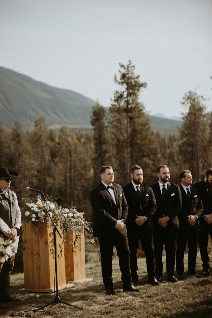 Groom, watching the bride walk down the aisle