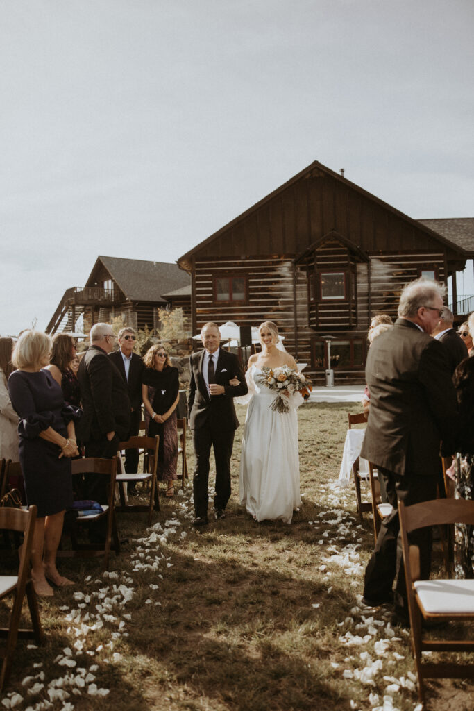 Stunning picture of the bride walking down the aisle