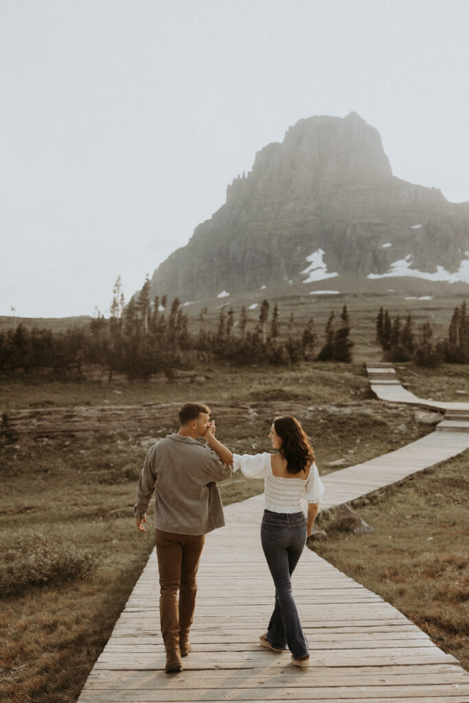 newly engaged couple holding hands during their photoshoot