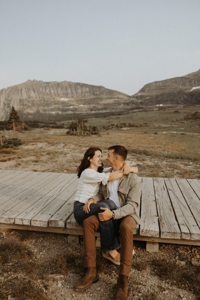 cute picture of the newly engaged couple smiling at each other