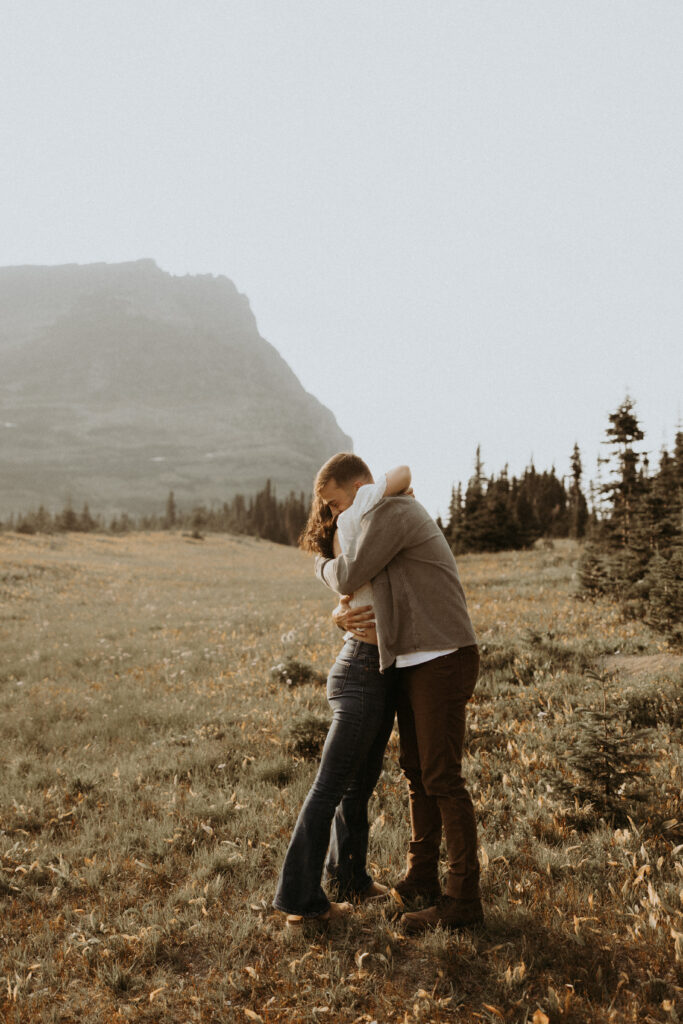 cute picture of the newly engaged couple hugging