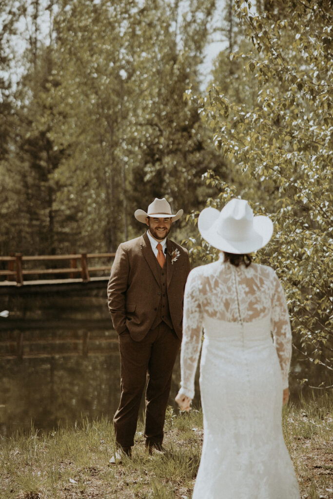 groom emotional seeing the bride in her wedding dress