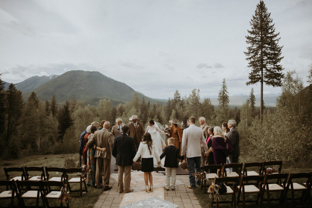 family member praying for the bride and groom