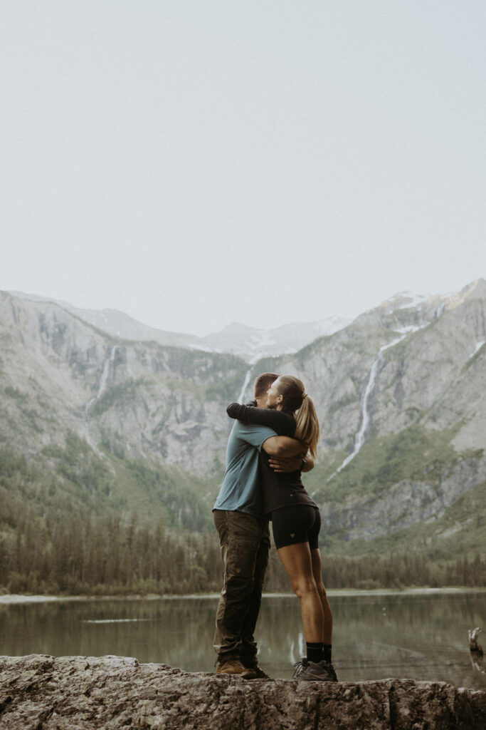 cute picture of the newly engaged couple kissing