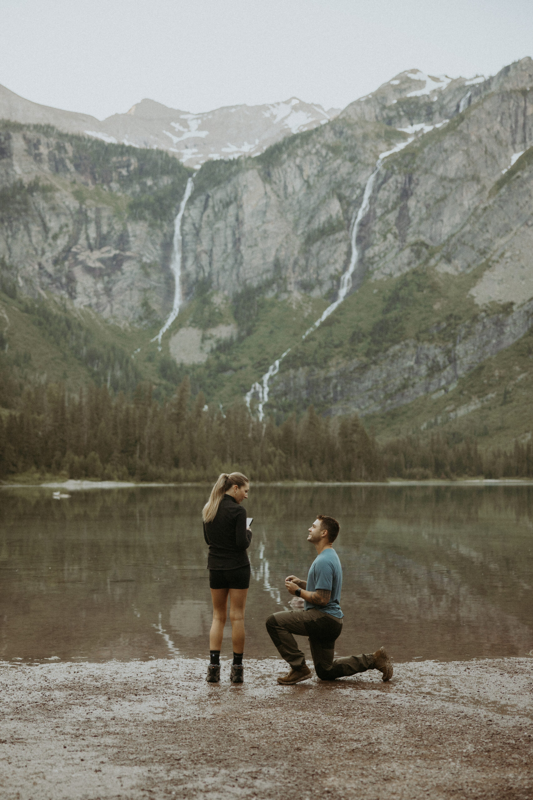 happy couple at their proposal in glacier park