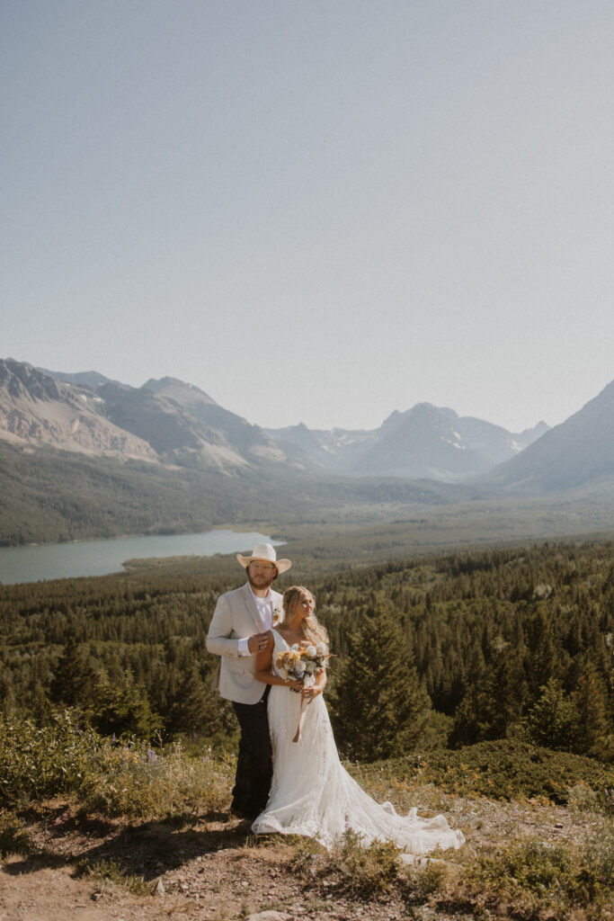 Cute picture of the bride and groom, smiling at the camera