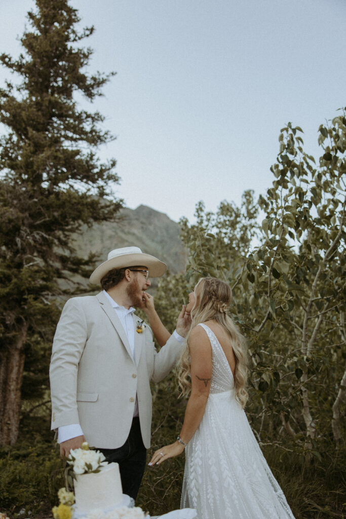 Newlyweds trying their elopement cake