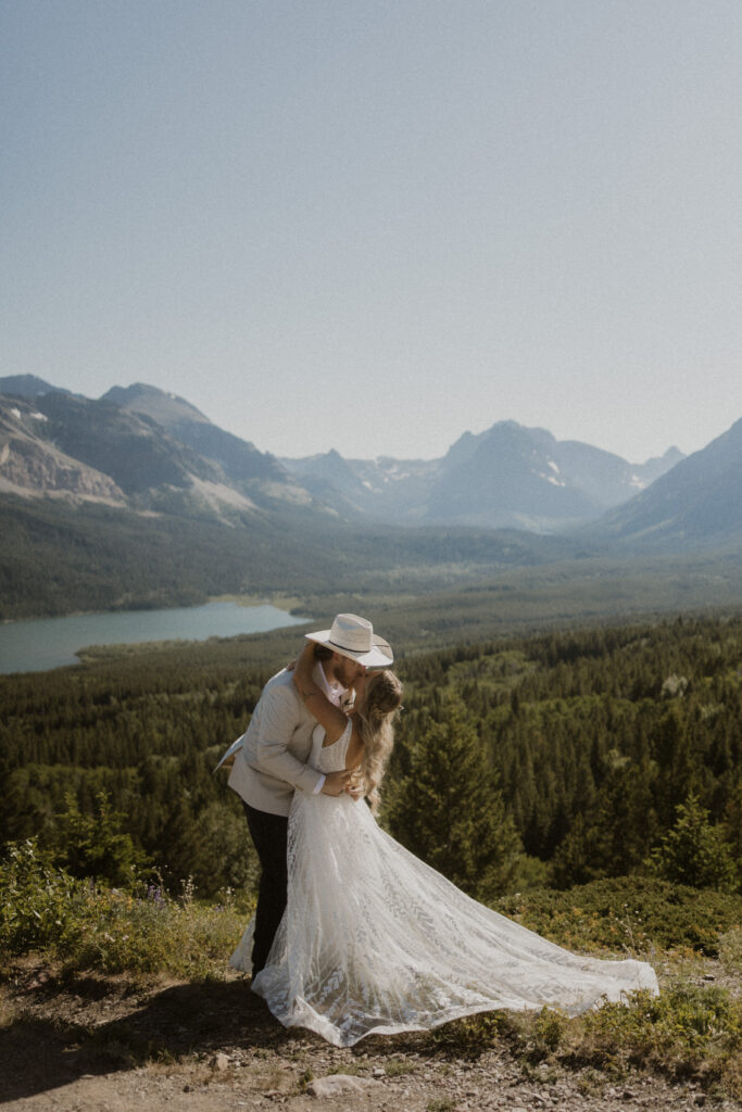 Bride and groom, kissing after their elopement ceremony