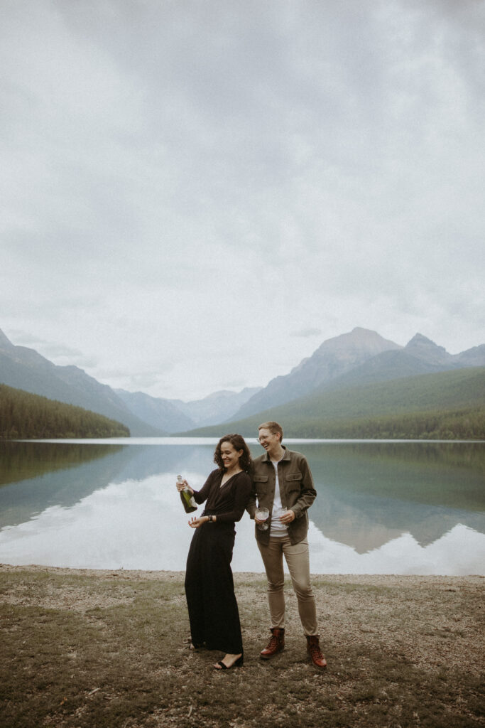 couple celebrating their engagement with champagne