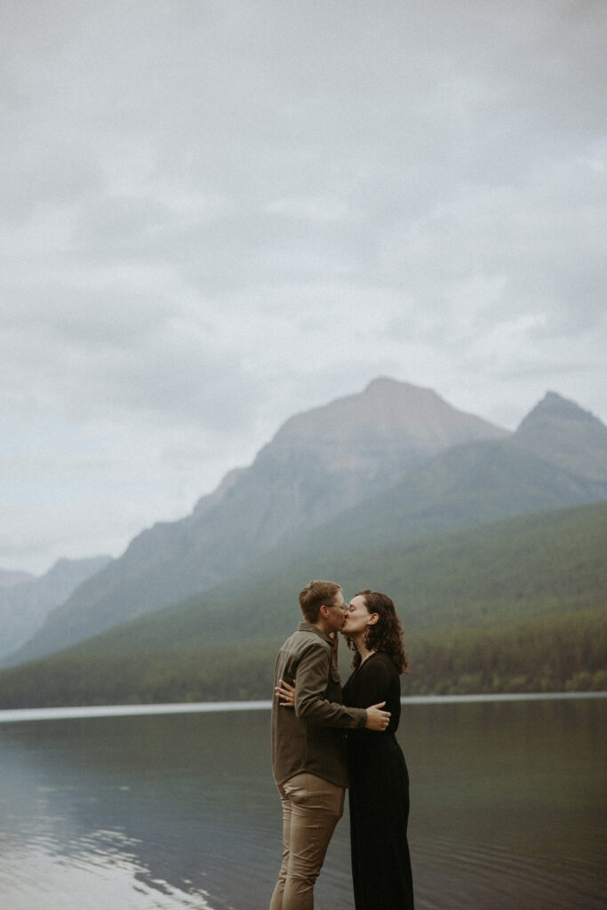 Couple kissing after their engagement