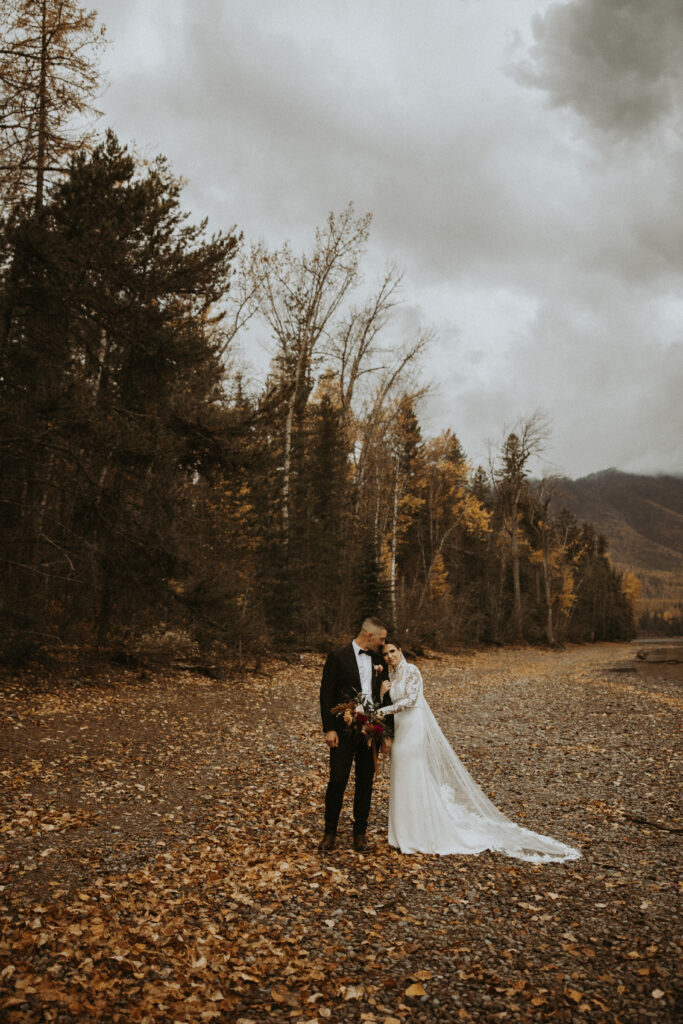 bride kissing the groom on the cheek