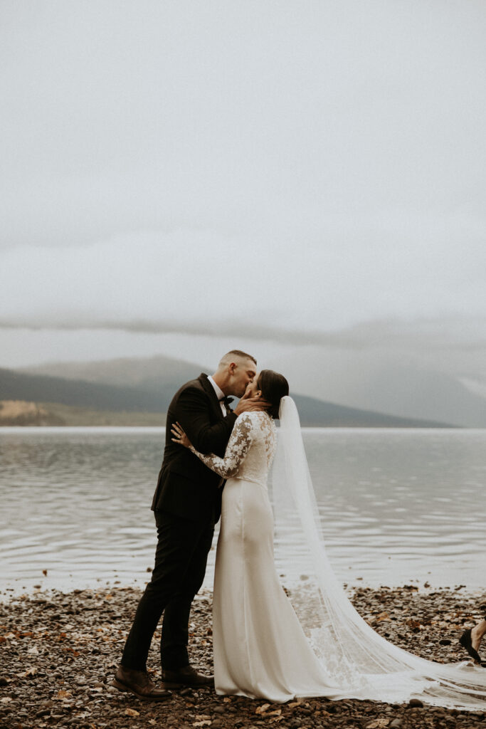 cute portrait of the bride and groom kissing after their ceremony