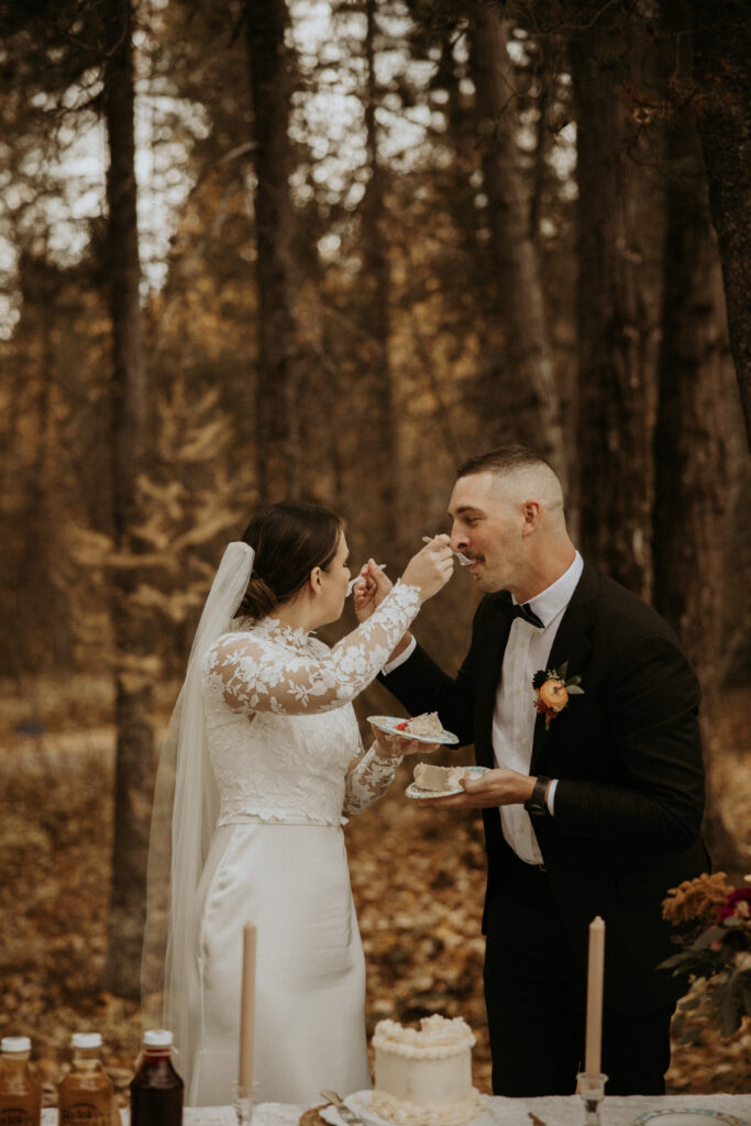 Newly married couple trying their wedding cake