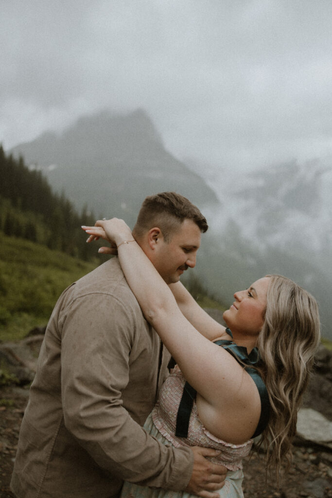 portrait of the newly engaged couple smiling at each other