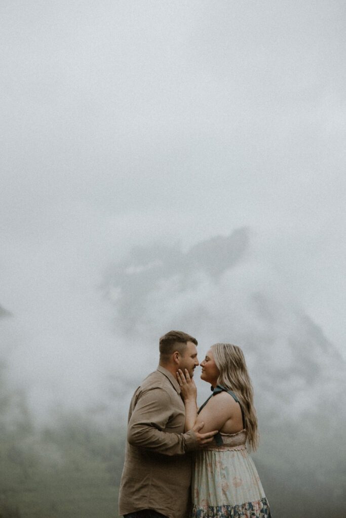 portrait of the newly engaged couple kissing