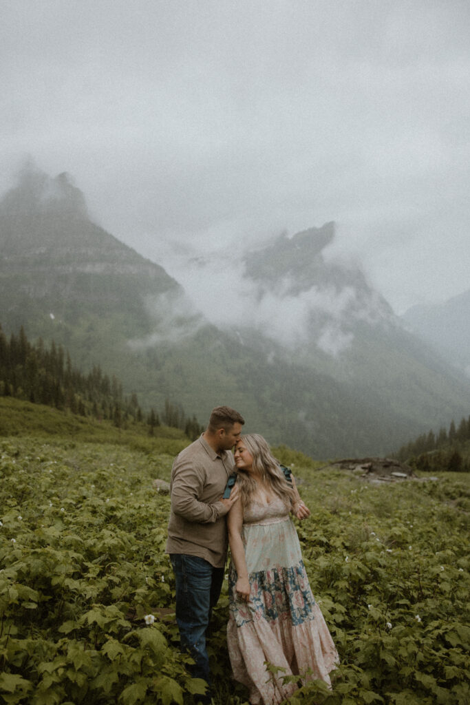 fiance kissing his fiance on the cheek