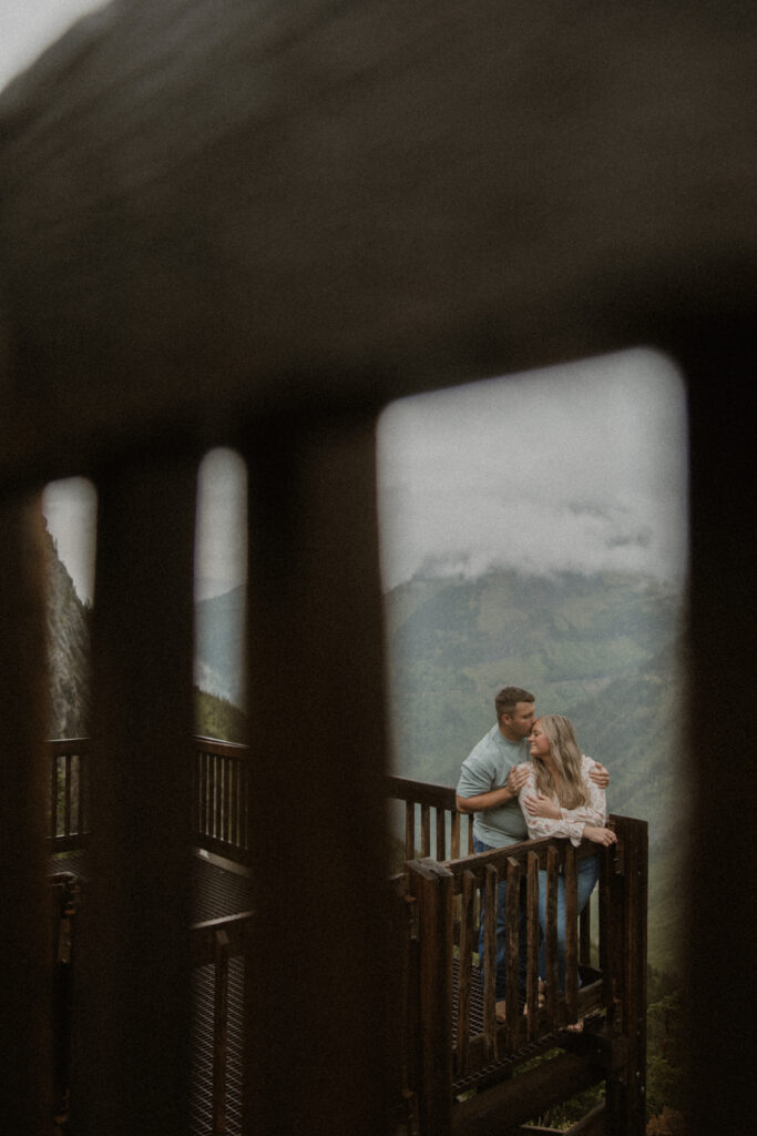 fiance kissing his fiance on the forehead