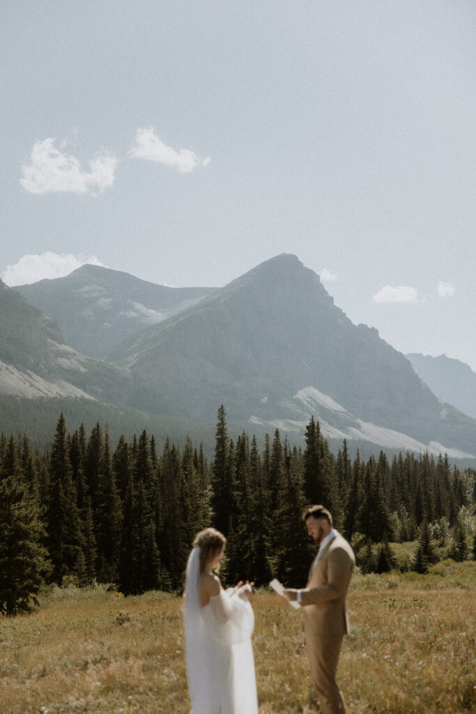 Bride and groom, reading their wedding vows