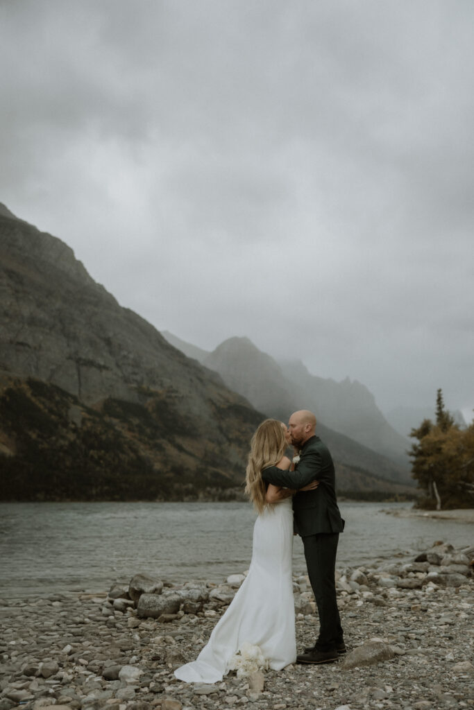 bride and groom kissing after their ceremony