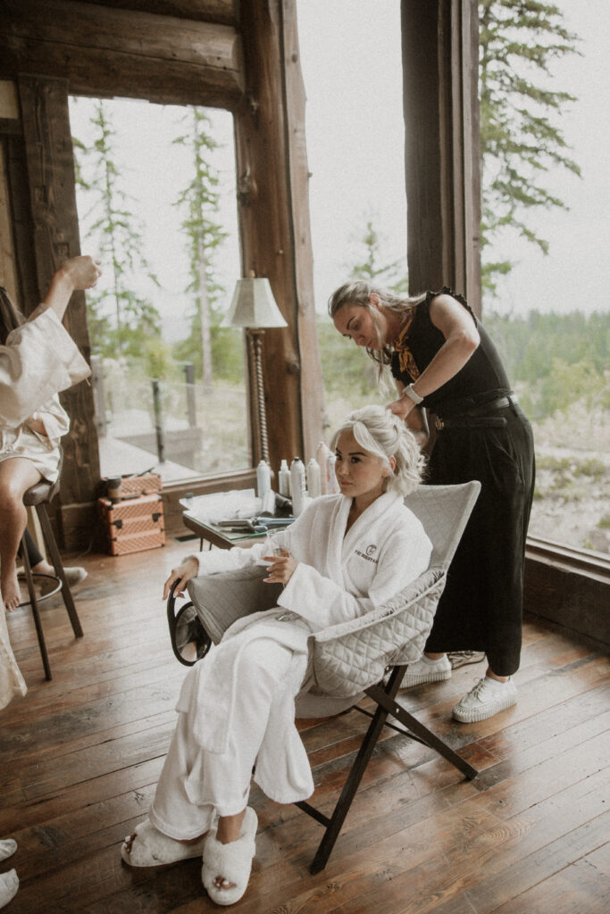 picture of the bride getting her hair done before the ceremony