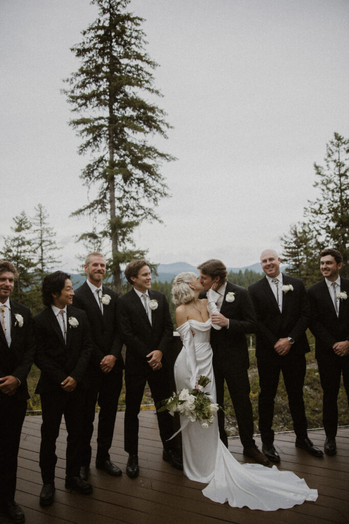 cute picture of the bride and groom kissing