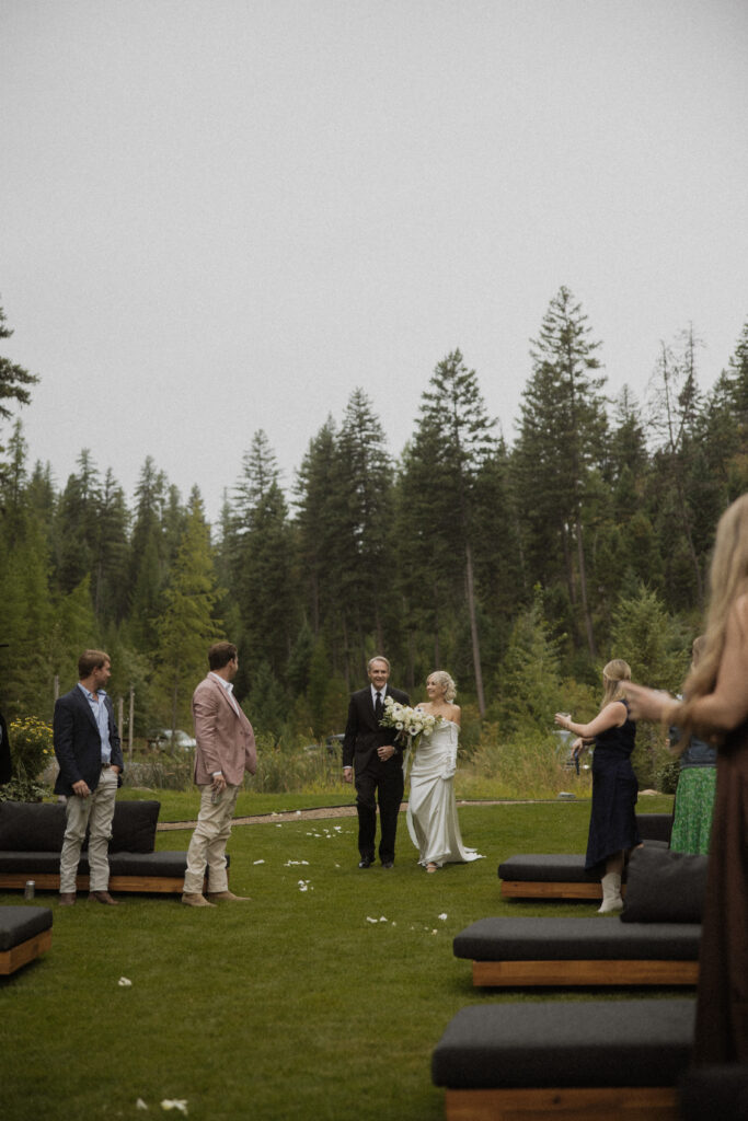 stunning picture of the bride walking down the aisle