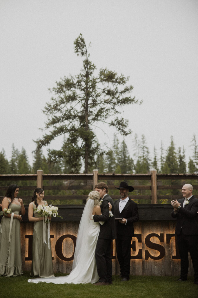 bride and groom kissing after their ceremony