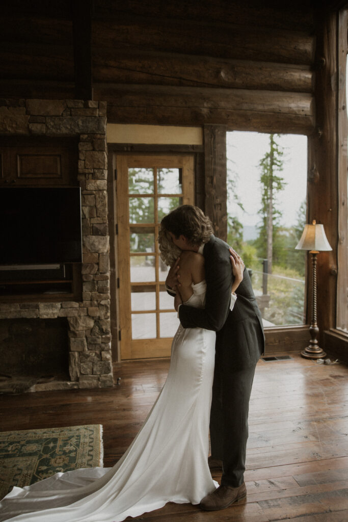 cute picture of the bride and groom hugging at their first look