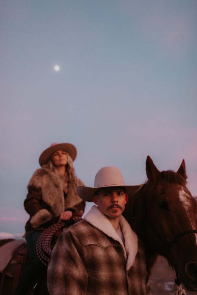 couple smiling at each other during their engagement pictures