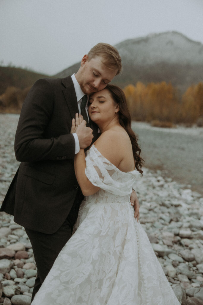 Portrait of the newly-married couple hugging