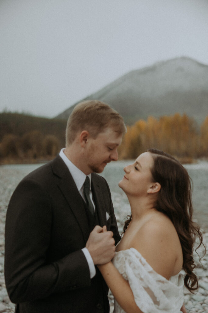 Picture of the newly married couple smiling at each other