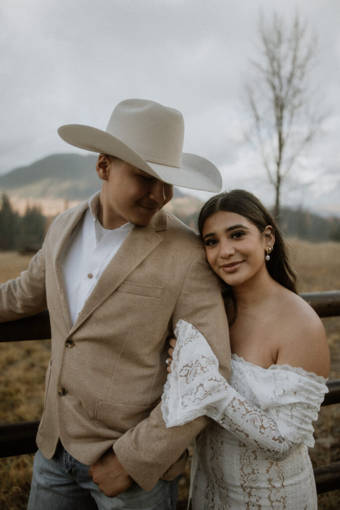 couple smiling at the camera during their photoshoot