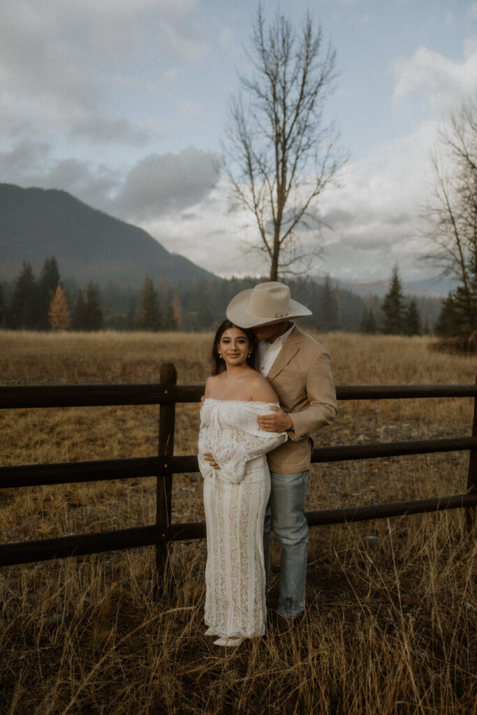 groom kissing the bride on the cheek