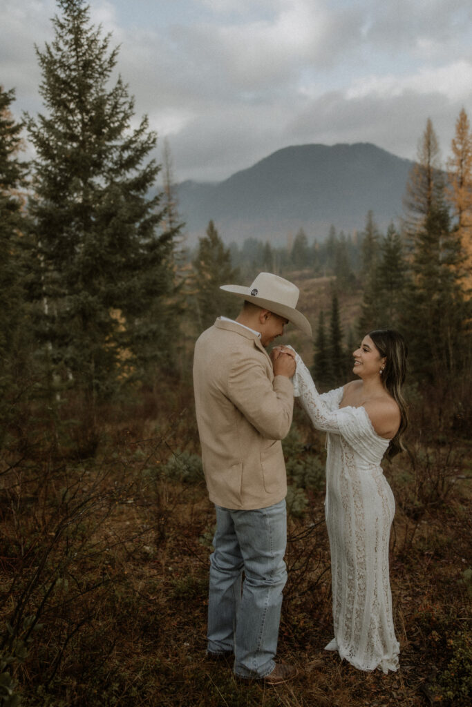 cute picture of the bride and groom holding hands